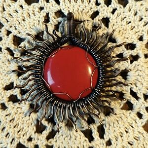 Striking, Bold, Round- Shaped Natural Red Coral Pendant With Sunburst Design.